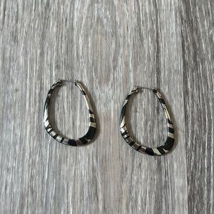 Silver and black earrings.